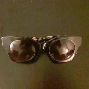Ted Baker of London 52mm black with animal print inside. Dark lenses